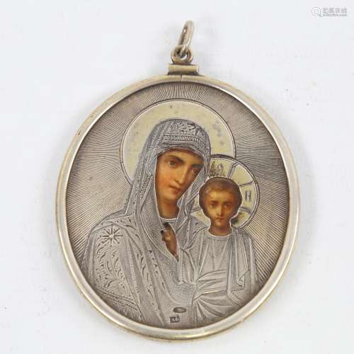A Russian silver oval icon pendant, engraved silver mount wi...
