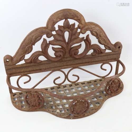 A cast-iron backed wall hanging plant rack, width 38.5cm, he...
