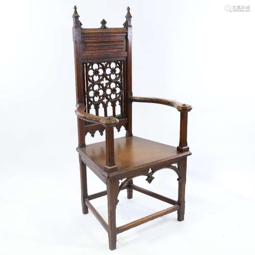 A Victorian Gothic hall chair, carved and pierced Gothic tra...