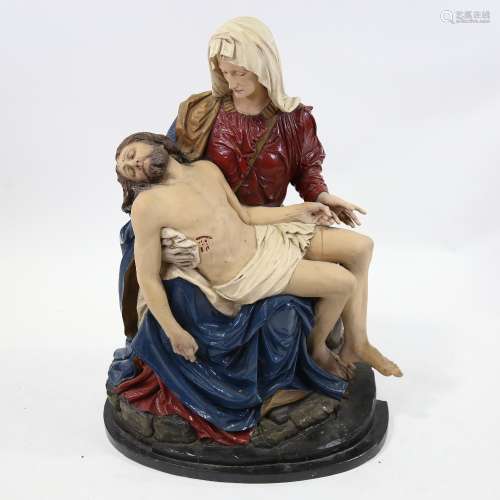 A large 19th century carved and painted wood religious sculp...