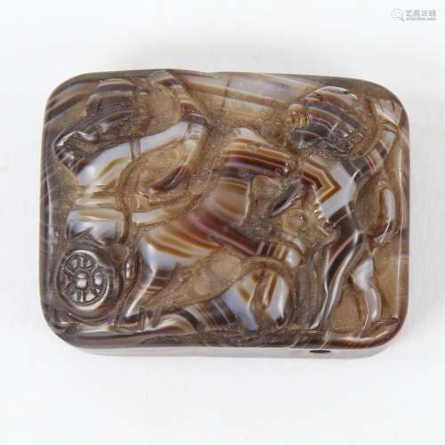 A Roman banded agate plaque, with relief carved scene depict...