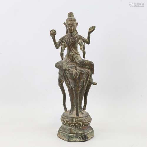 A patinated bronze Indian deity on elephant base, height 25c...