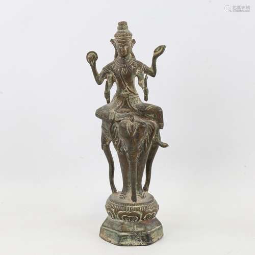 A patinated bronze Indian deity on elephant base, height 25c...