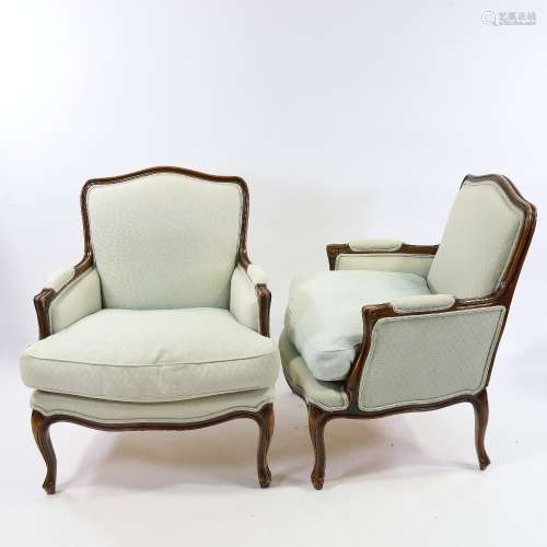 A pair of Louis XVI style walnut-framed upholstered salon ch...