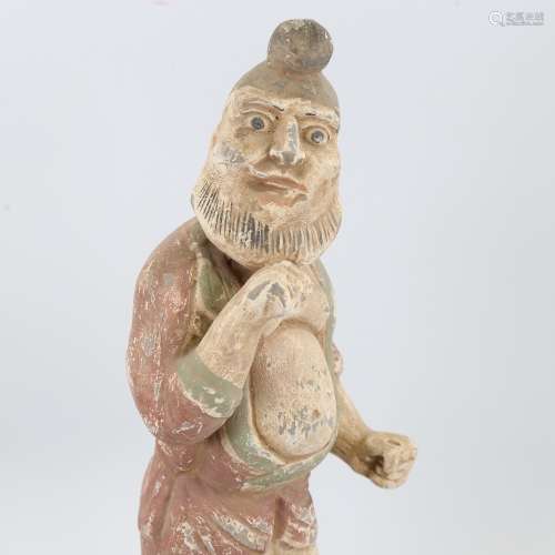 An Indian/Chinese painted terracotta standing figure wearing...