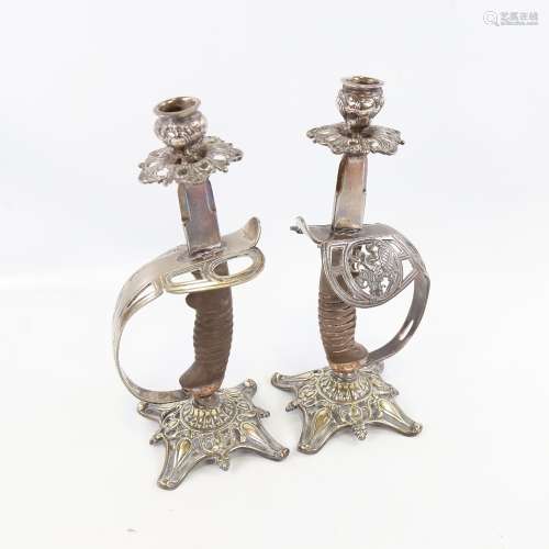 A pair of 19th century candlesticks made from sword hilts, n...