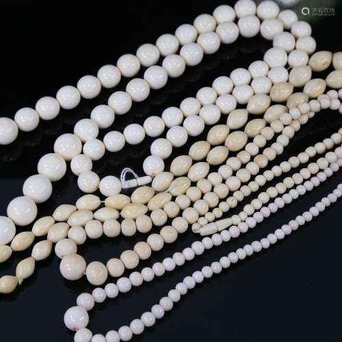 A collection of ivory bead necklaces