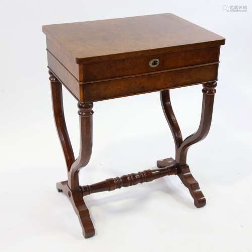 A burr-walnut sewing table of rectangular form, with rising ...