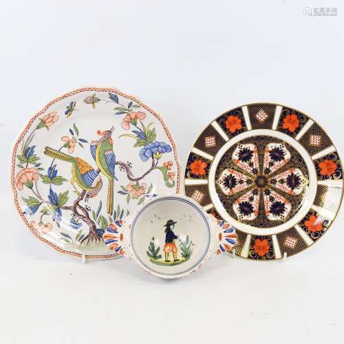 A French faience pottery plate with exotic birds, 23cm acros...