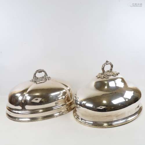 2 19th century oval silver plated meat covers with cast hand...