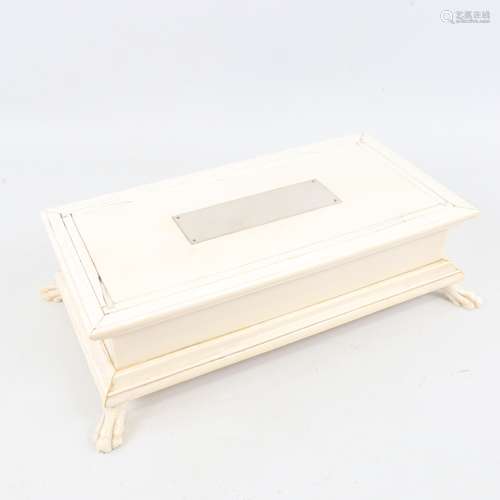 An early 20th century ivory desktop cigar box, unmarked gold...