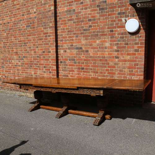 A large Maple & Co oak extending refectory dining table, wit...