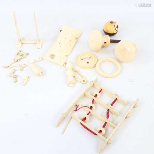 A collection of Chinese ivory and bone puzzles, miniature fi...