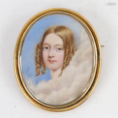 A 19th century miniature painting on ivory, portrait of a yo...