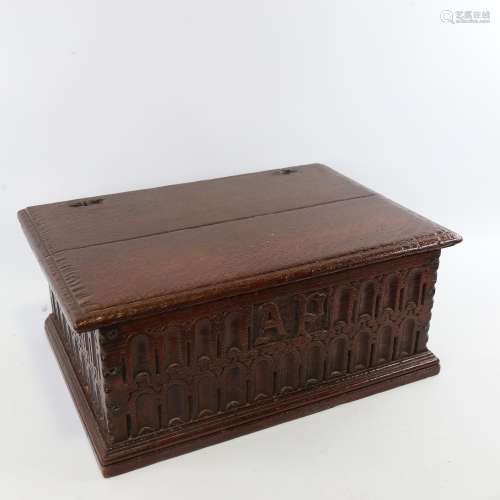 An 18th century oak Bible box, with Arcadian carved front pa...
