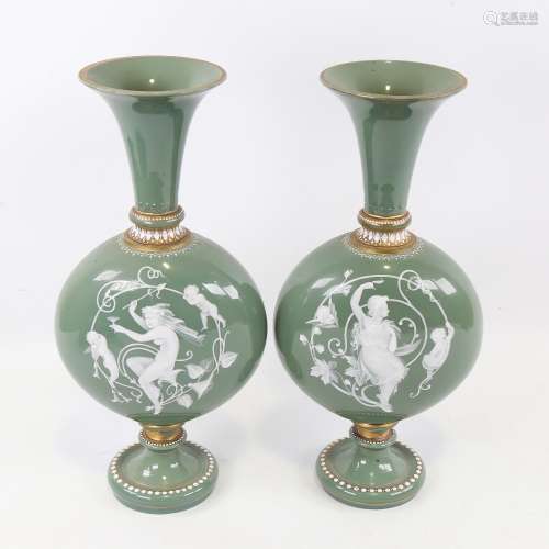 A pair of 19th century green glass moon-shaped vases with pa...