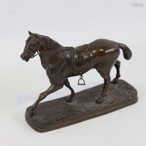 A small 19th century bronze patinated spelter saddled horse,...