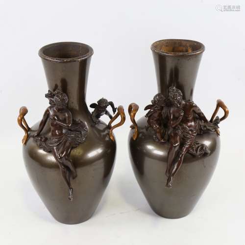 A pair of 19th century patinated metal vases, surmounted by ...