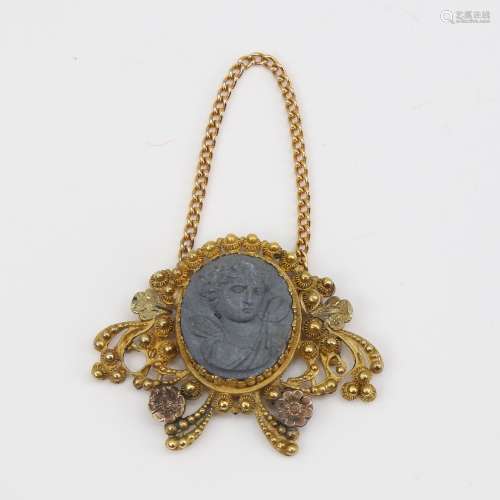 A Victorian unmarked gold lava cameo pendant, relief carved ...