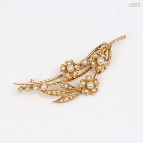 A Victorian unmarked gold and pearl floral brooch, brooch le...