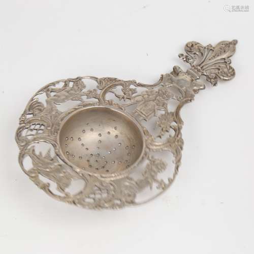 A late 19th/early 20th century German silver tea strainer, r...