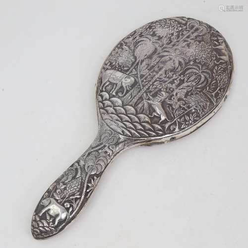 An unmarked Indian silver dressing table hand mirror, allove...