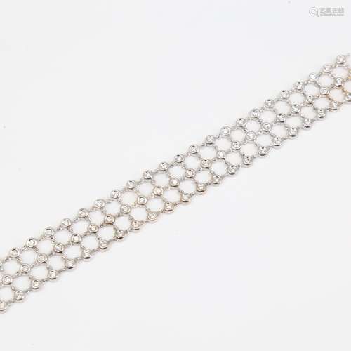 A modern 18ct white gold diamond triple-line bracelet, set w...