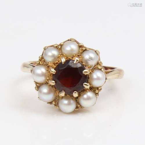 A late 20th century unmarked gold garnet and pearl cluster r...
