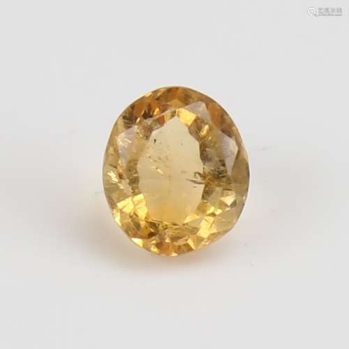 A 2.78ct unmounted oval mixed-cut Madeira yellow citrine, di...