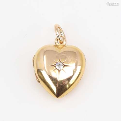 A Victorian 18ct gold diamond set heart locket pendant, set ...