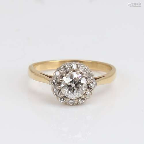 An 18ct gold diamond cluster halo ring, set with old Europea...