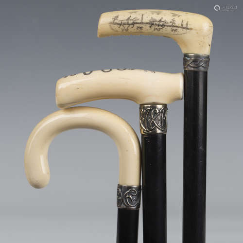 A late Victorian ebonized walking cane, the ivory handle eng...