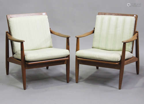 A pair of mid-20th century retro-design teak framed armchair...