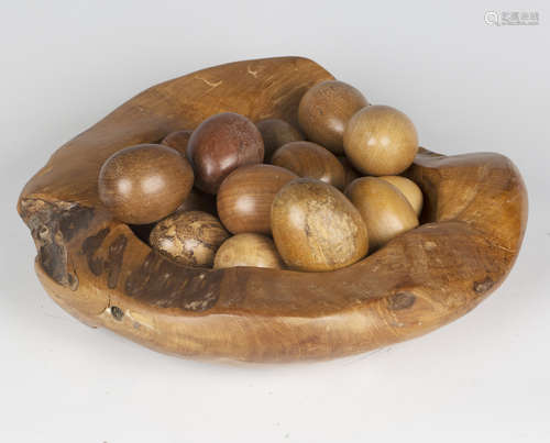 A selection of seventeen turned wooden specimen eggs, includ...