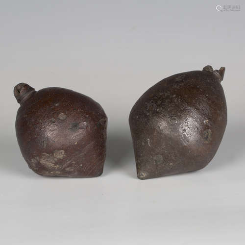 Two Byzantine dark brown glazed pottery 'Greek Fire' hand gr...