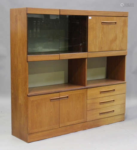 A mid-20th century teak side cabinet of retro design, fitted...