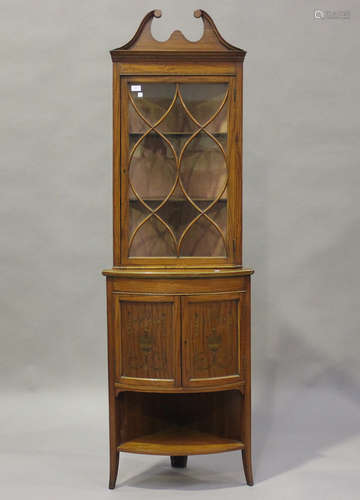 An Edwardian satinwood corner display cabinet, inlaid with u...