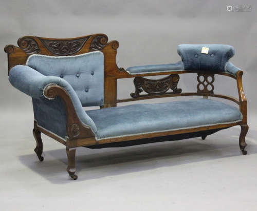 A late Victorian walnut showframe daybed settee, upholstered...