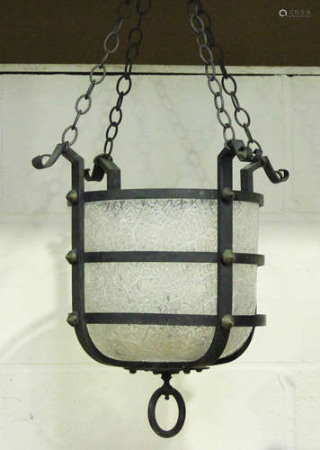 An early 20th century wrought iron hanging lantern, fitted w...