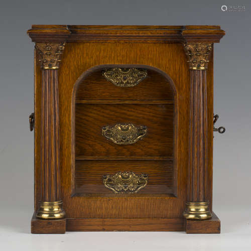 An Edwardian oak and gilt metal mounted table-top collector'...