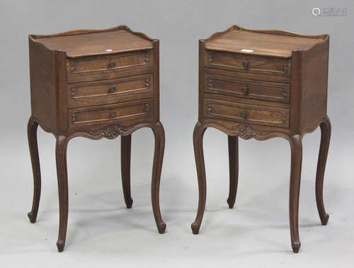 A pair of 20th century French oak bedside chests with galler...