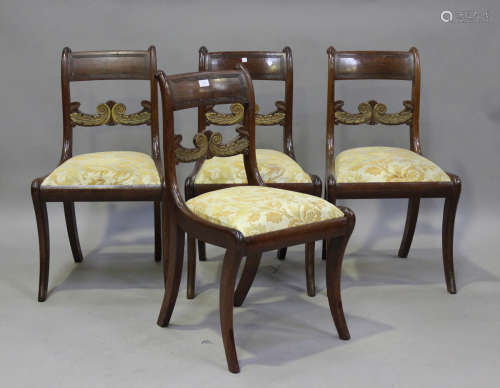 A set of four Regency mahogany bar back dining chairs, on sa...