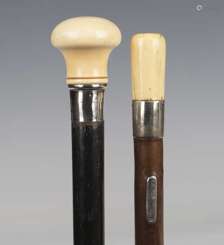 A late 19th century ebonized walking cane with ivory handle ...