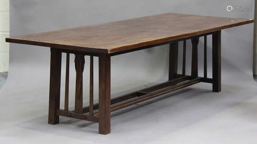 A 20th century Arts and Crafts stained oak refectory table w...