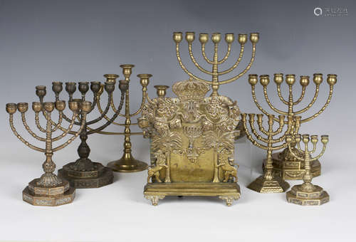 A 19th century brass Hanukkah menorah, the backplate with ap...