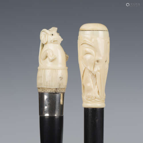 A late 19th/early 20th century ebonized walking cane, the iv...