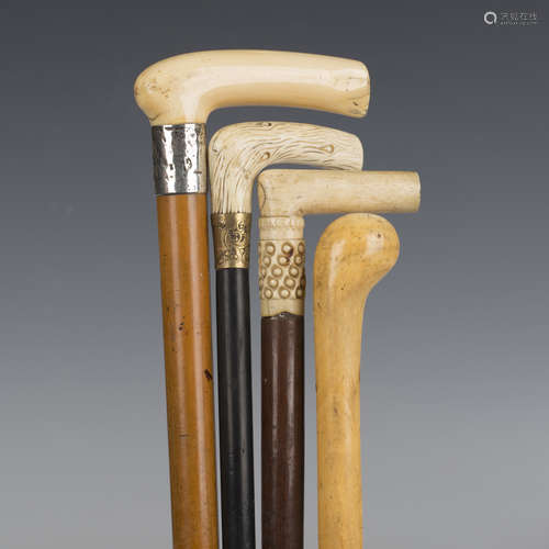 A late Victorian Malacca walking cane with an ivory handle a...