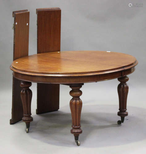 A mid-Victorian mahogany extending dining table, the oval to...