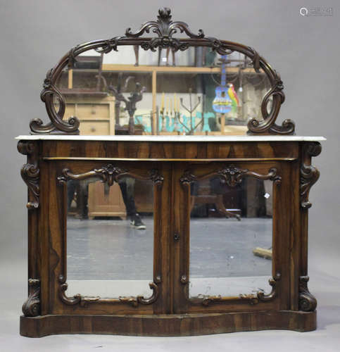 A Victorian rosewood serpentine fronted chiffonier with a mi...