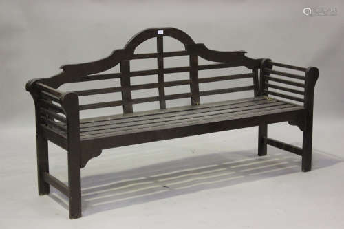 A 20th century stained hardwood garden bench, after a design...